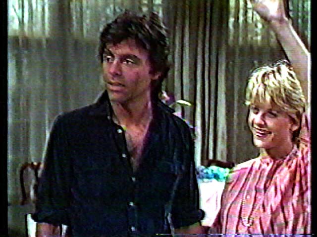 Screen shot of Frank Runyeon and Meg Ryan in As the World Turns (1984).